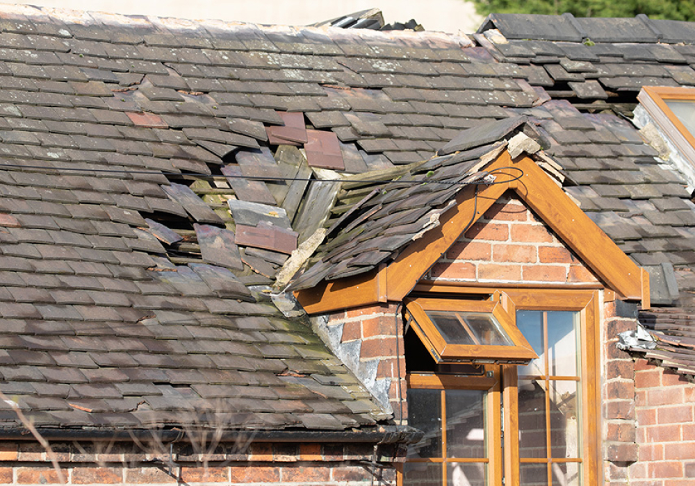 Slipped and missing slates on a period roof, repaired by GMG Roof Experts in Hillingdon