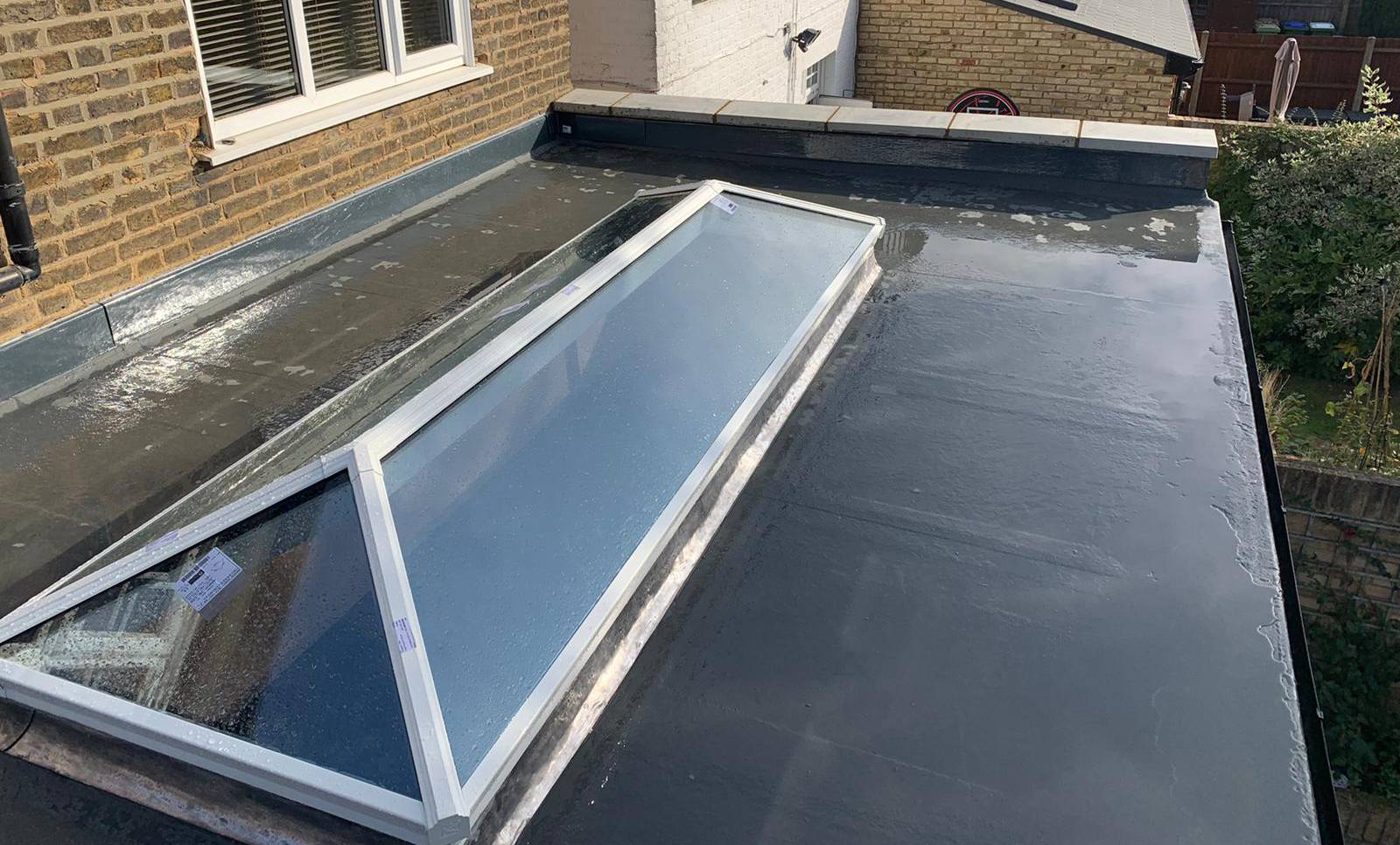 A GRP fibreglass flat roof with a rooflight lantern by GMG Roof Experts in Hillingdon