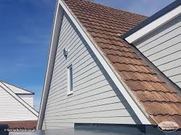 Matched timber barge board fitted to a period gable by GMG Roof Experts in Hillingdon