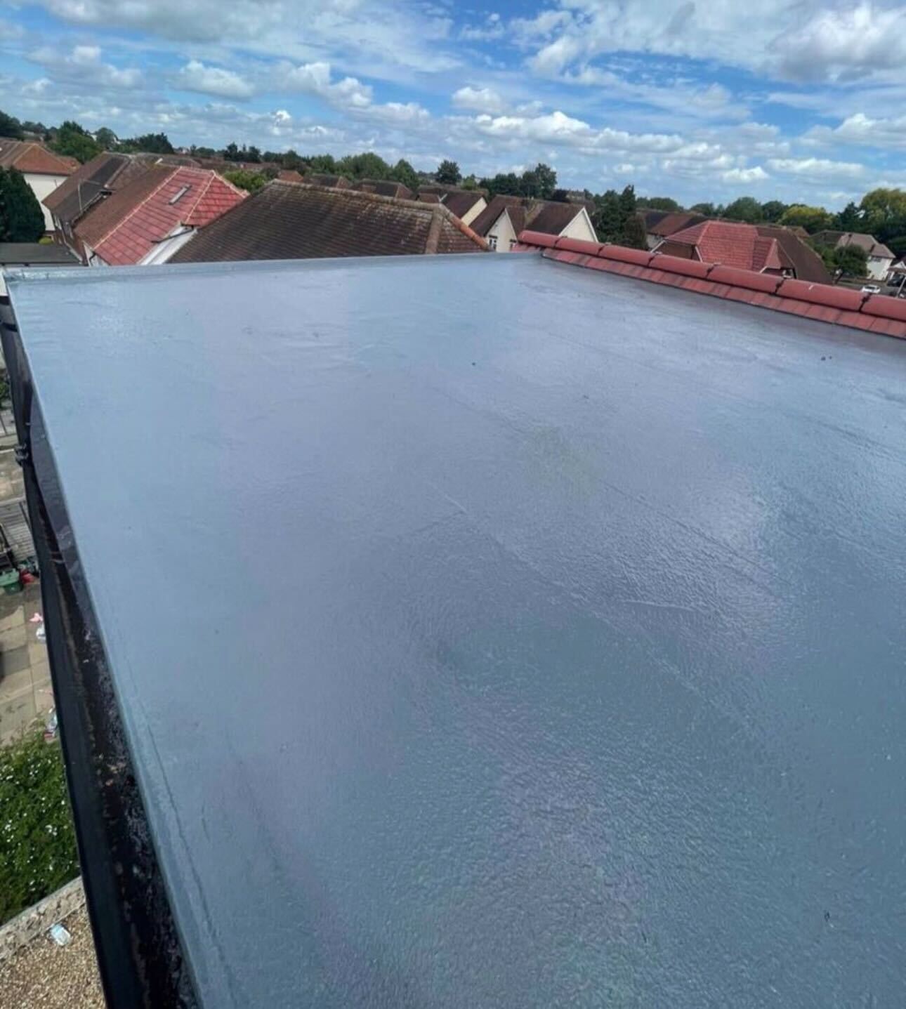Fibreglass flat roof checked during a survey by GMG Roof Experts in the Hillingdon area